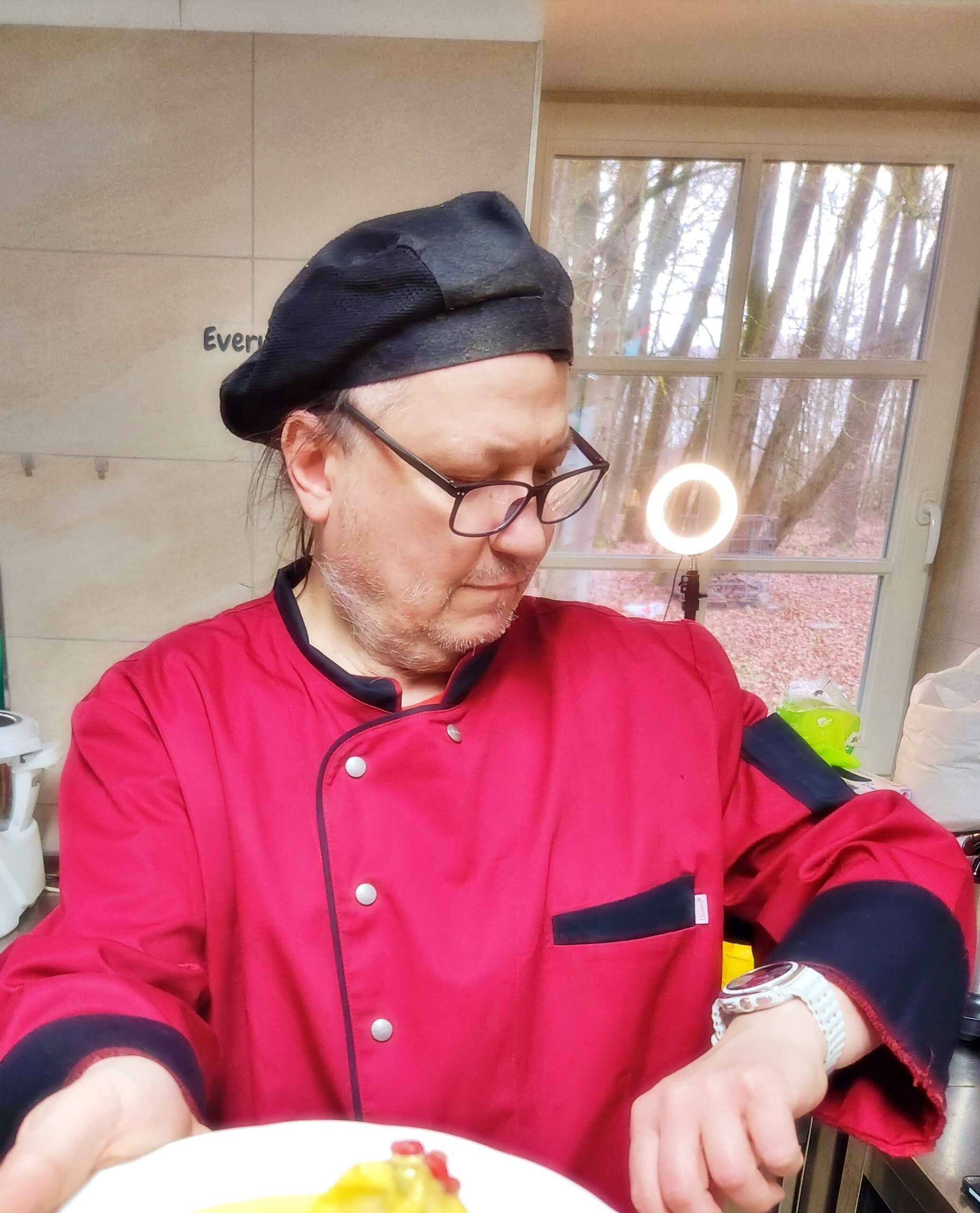 Piotr Krupa - Head Chef Rude Kitchen, in red chef jacket and black beret
